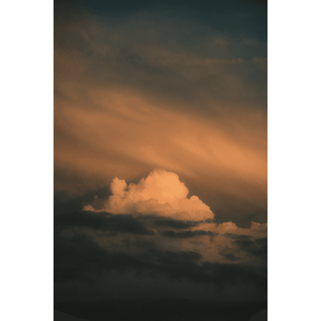 a puffy cloud glowing in sunset